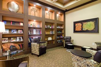 Open library concept with ample lighting and work space areas at Ashley Auburn Pointe in Atlanta, GA
